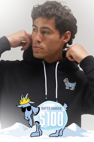 Person wearing a black hoodie with a graphic design on a gray background