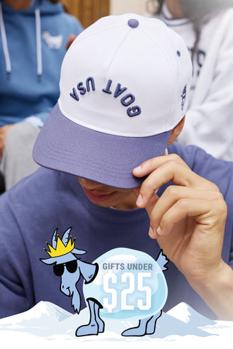 Person wearing a white and navy cap with text, looking down, with a promotional graphic overlay.