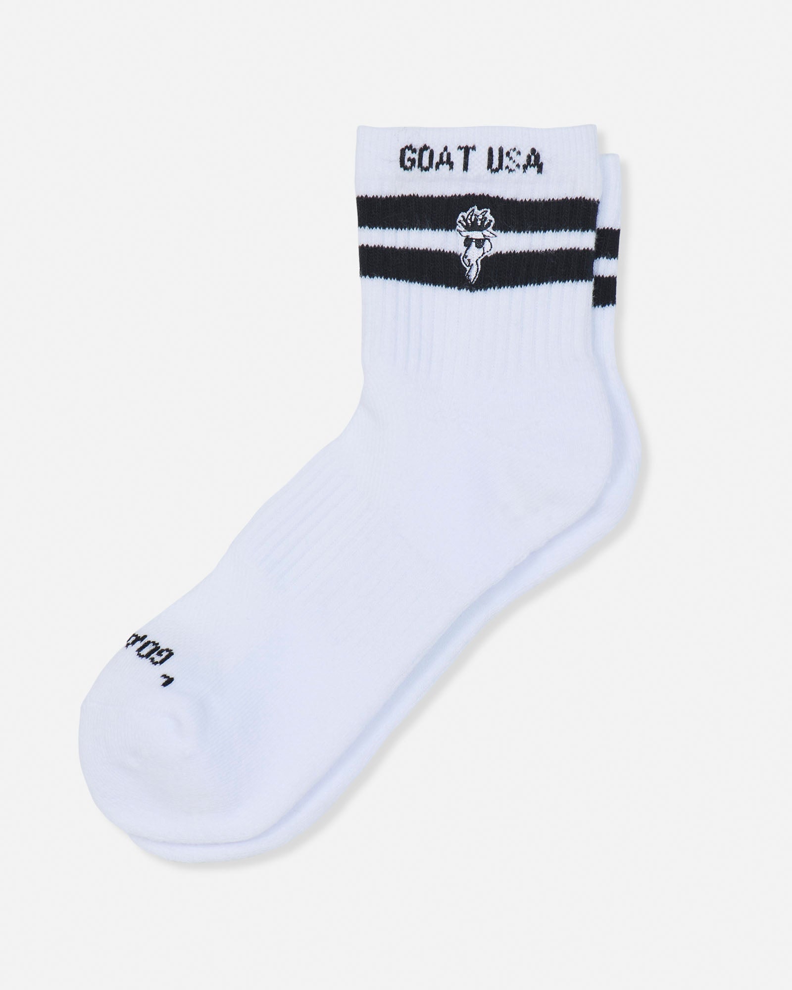 A single white crew sock with black stripes and 'GOAT USA' text on the cuff, displayed on a light gray background.#color_white