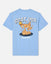 A light blue short-sleeve t-shirt shown from the back, featuring a cartoon graphic of a goat wearing a crown and standing on chocolate chip cookies, with the text 'GOAT USA' and 'Sweet Bites'.