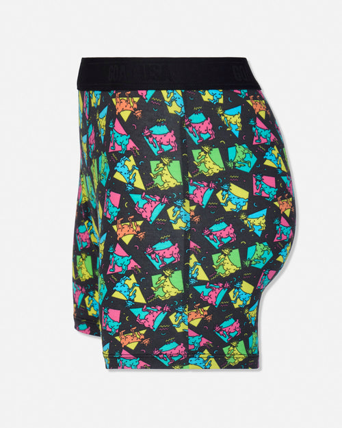 A pair of boxer briefs featuring a vibrant, multicolored geometric pattern of stylized cartoon goats on a black background, with a solid black waistband.