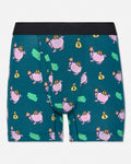 A pair of men's boxer briefs by GOAT USA, featuring a teal green background with a repeating pattern of pink pigs wearing gold crowns and holding yellow money bags, along with green dollar bill graphics. The waistband is solid black.