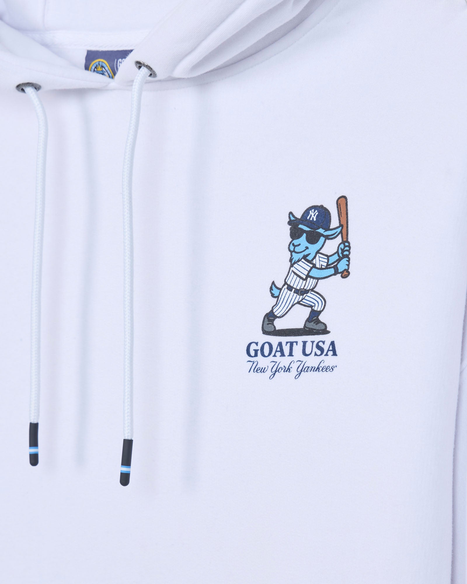 Close-up of left chest design with blue baseball player goat mascot in a New York Yankees uniform