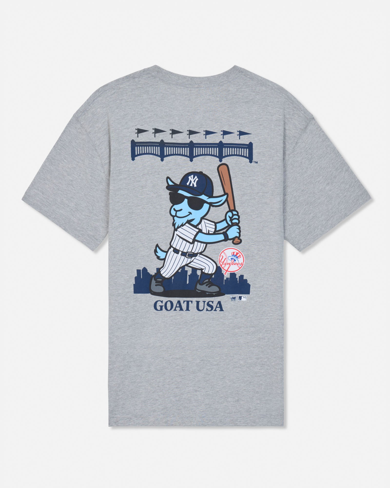 A heather gray short-sleeve t-shirt with a large graphic on the front featuring a cartoon blue goat in a New York Yankees uniform holding a bat, with 'GOAT USA' printed below.#color_gray