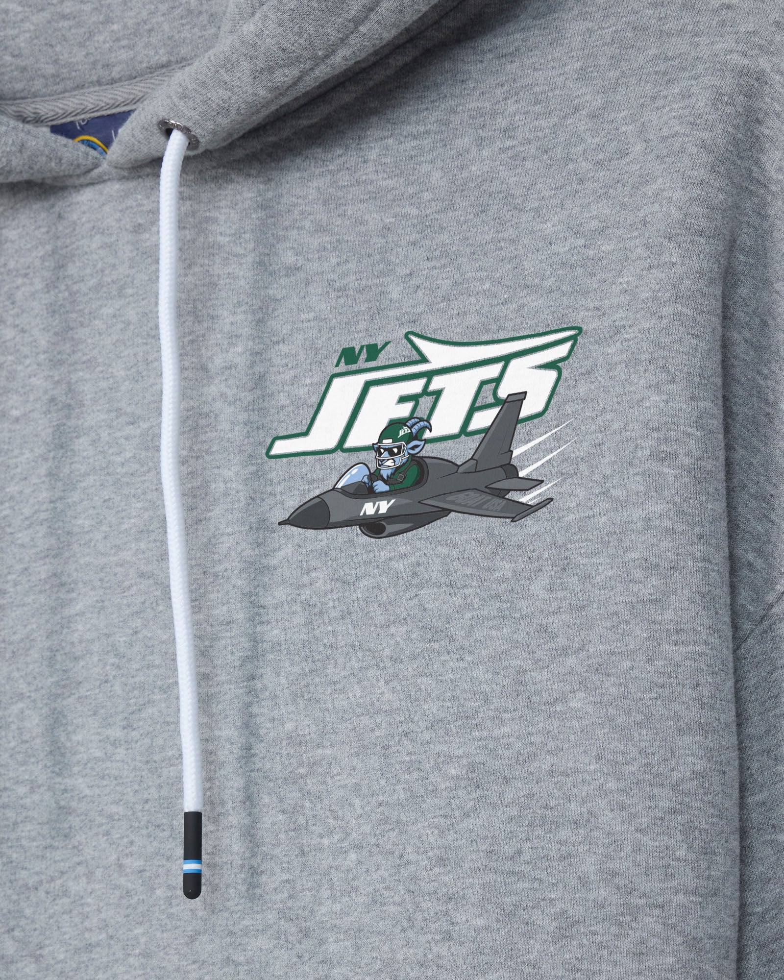 Close-up of a heather gray hoodie featuring a white drawstring and a green, white, and gray New York Jets graphic on the chest.