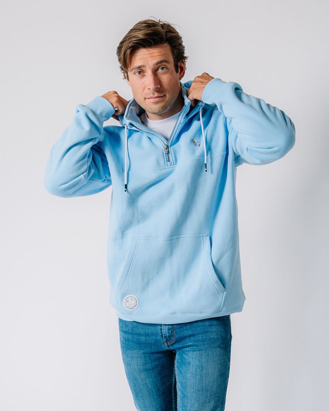 Model wearing carolina blue OG 1/4 Zip Hooded Sweatshirt#color_carolina-blue