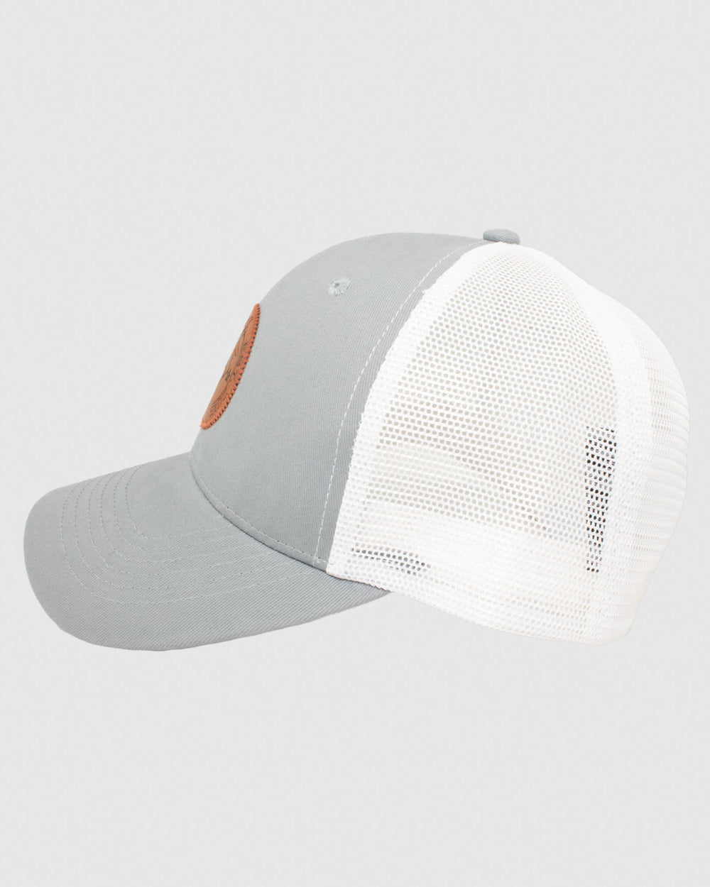 Side view of gray hat with white mesh and brown leather patch#color_charcoal