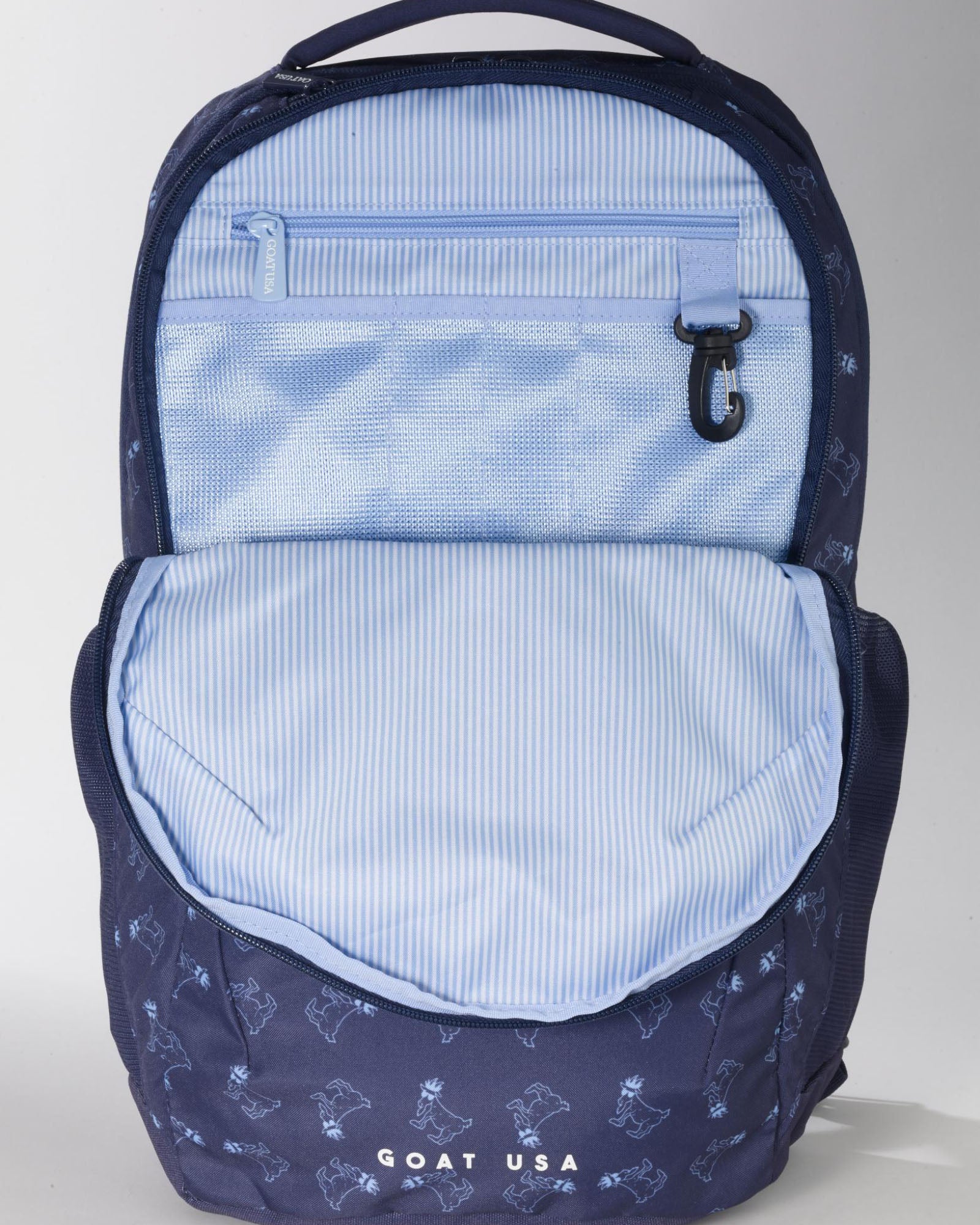 Navy backpack showcasing the inside lining#color_navy