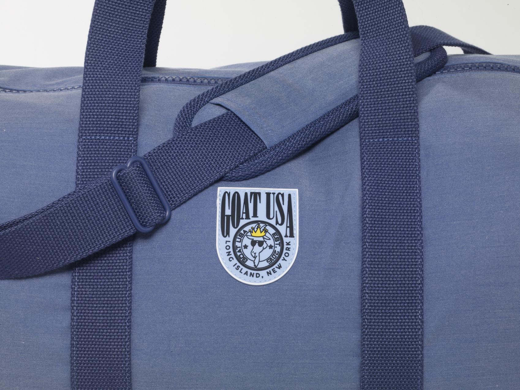 Close up of duffle bag logo#color_navy