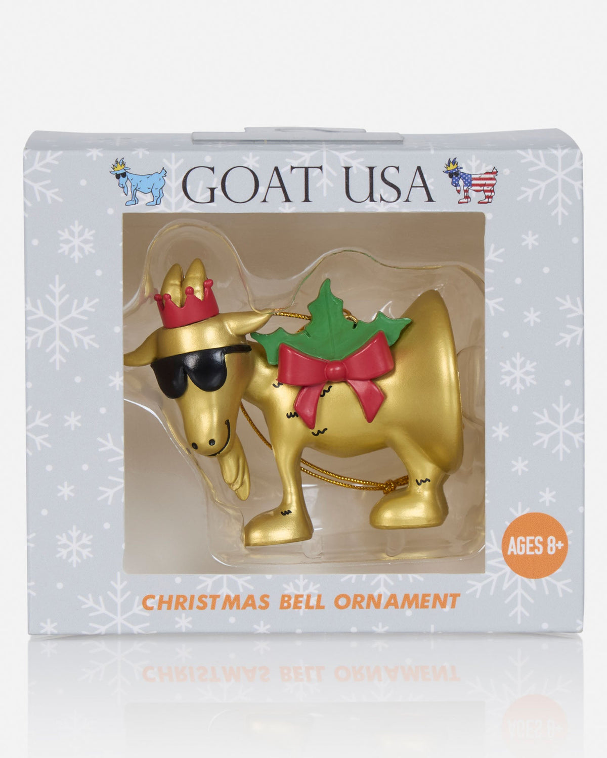 GOAT USA Christmas Bell Ornament in its retail packaging, featuring a gold bell-shaped ornament shaped like a goat wearing a red crown, black sunglasses, and a green holly leaf with a red bow.