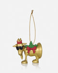 A gold Christmas ornament shaped like a moose wearing a red crown, black sunglasses, a green holly wreath with a red bow, and a gold hanging string, shown on a light gray background.