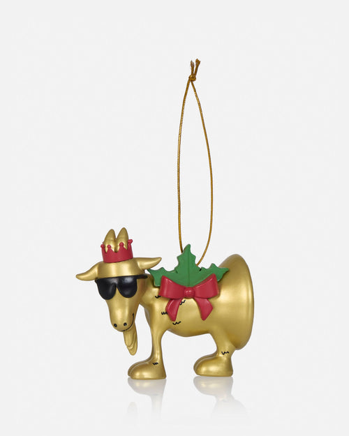 A gold Christmas ornament shaped like a moose wearing a red crown, black sunglasses, a green holly wreath with a red bow, and a gold hanging string, shown on a light gray background.