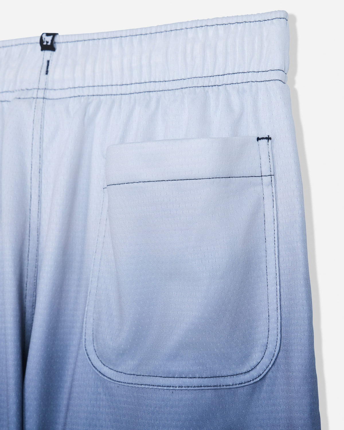 Close-up of back pocket on navy fade mesh shorts