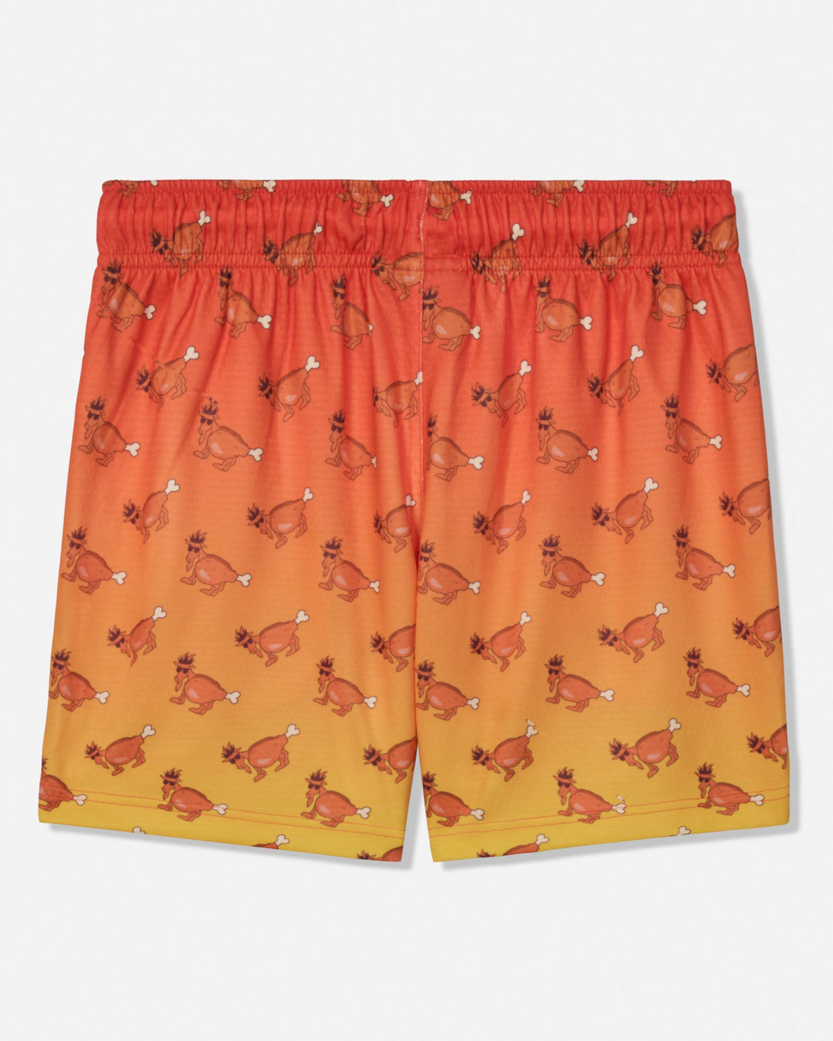 A pair of kids' athletic shorts featuring an orange and yellow gradient background with a repeating pattern of cartoon goat, shown against a plain white background.