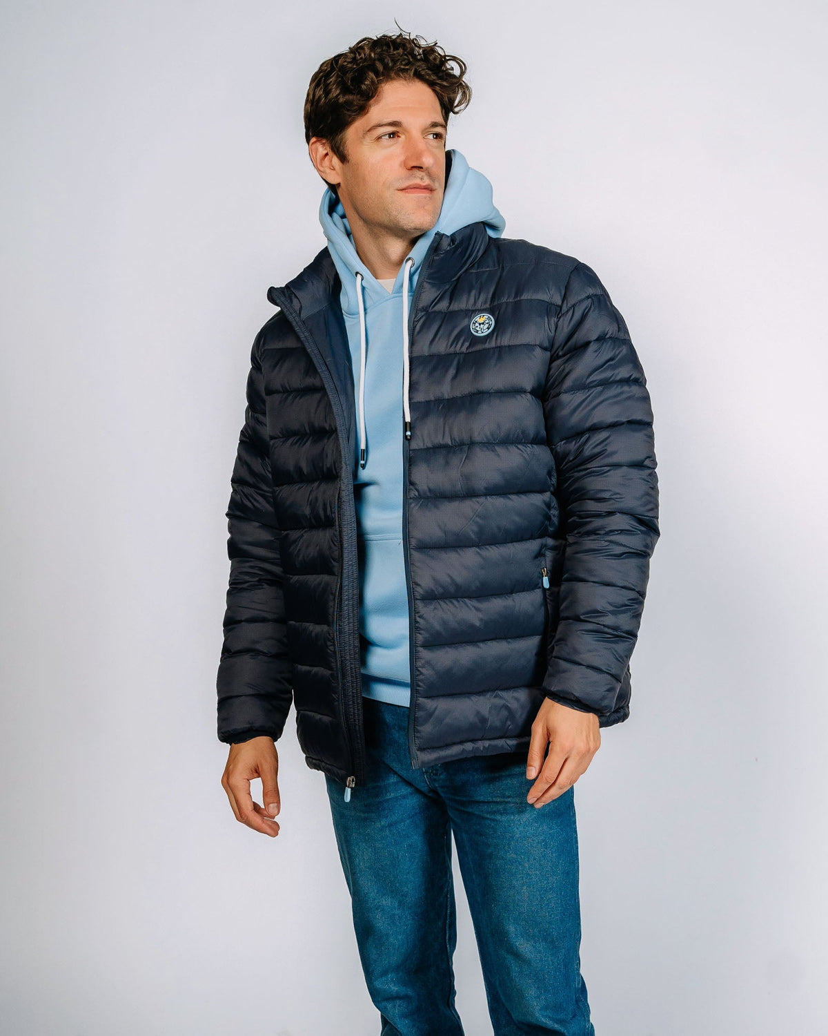Male model wearing dark navy puffer jacket