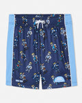 A pair of kids' athletic shorts in navy blue with a repeating cartoon goat pattern, featuring light blue side panels and a white drawstring.