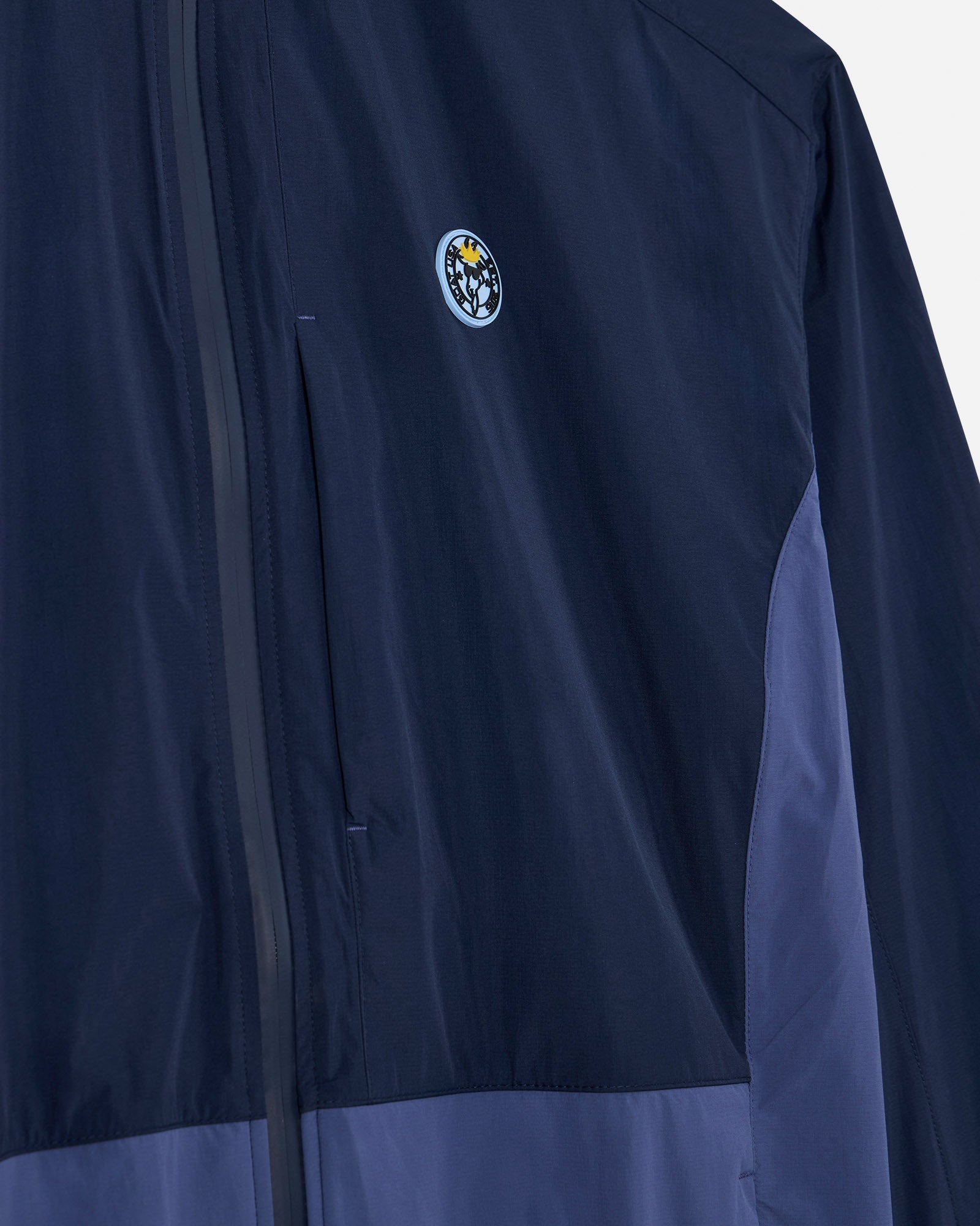 Angled view of navy windbreaker