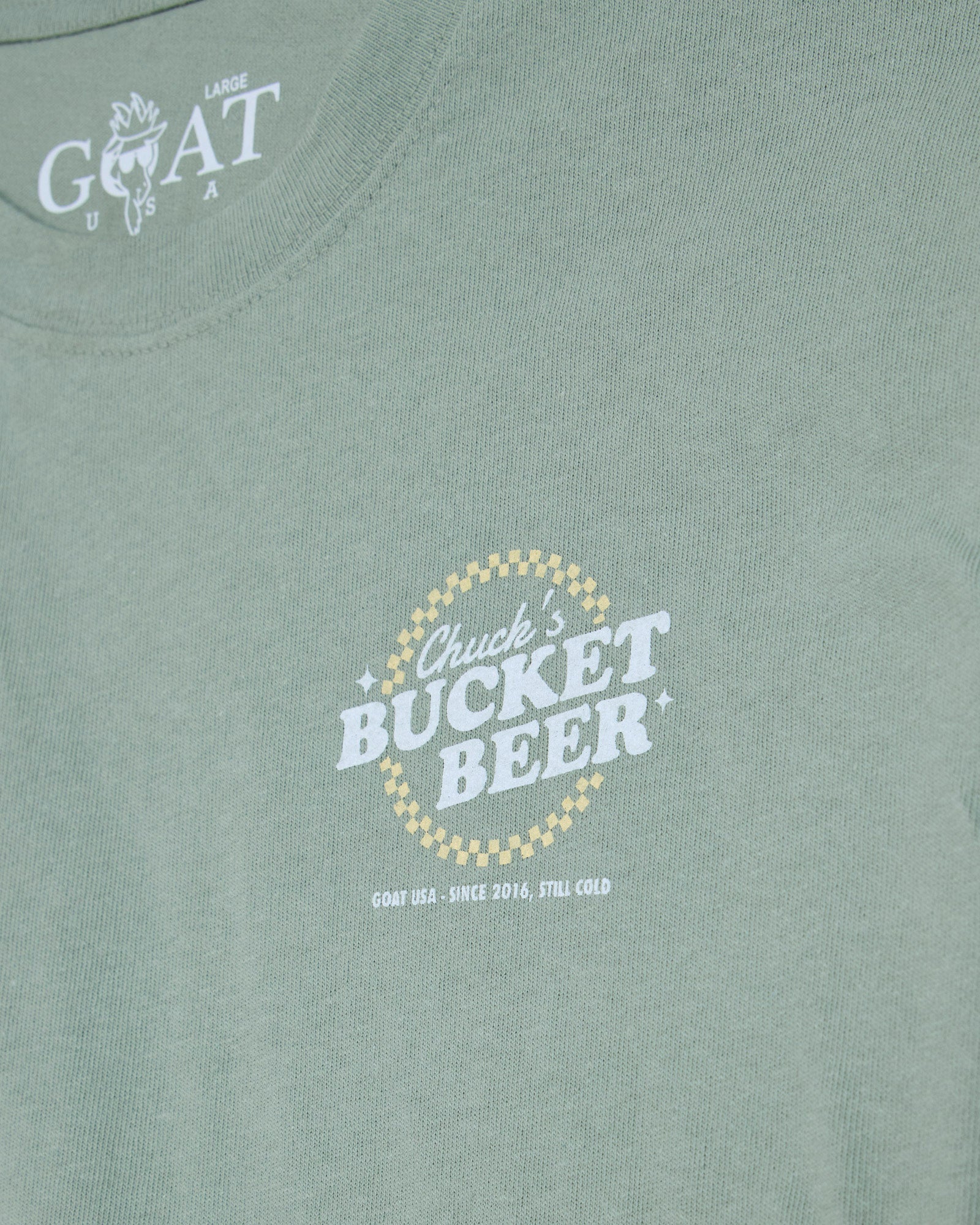 'Chuck's Bucket Beer' left-chest graphic on steeped sage t-shirt