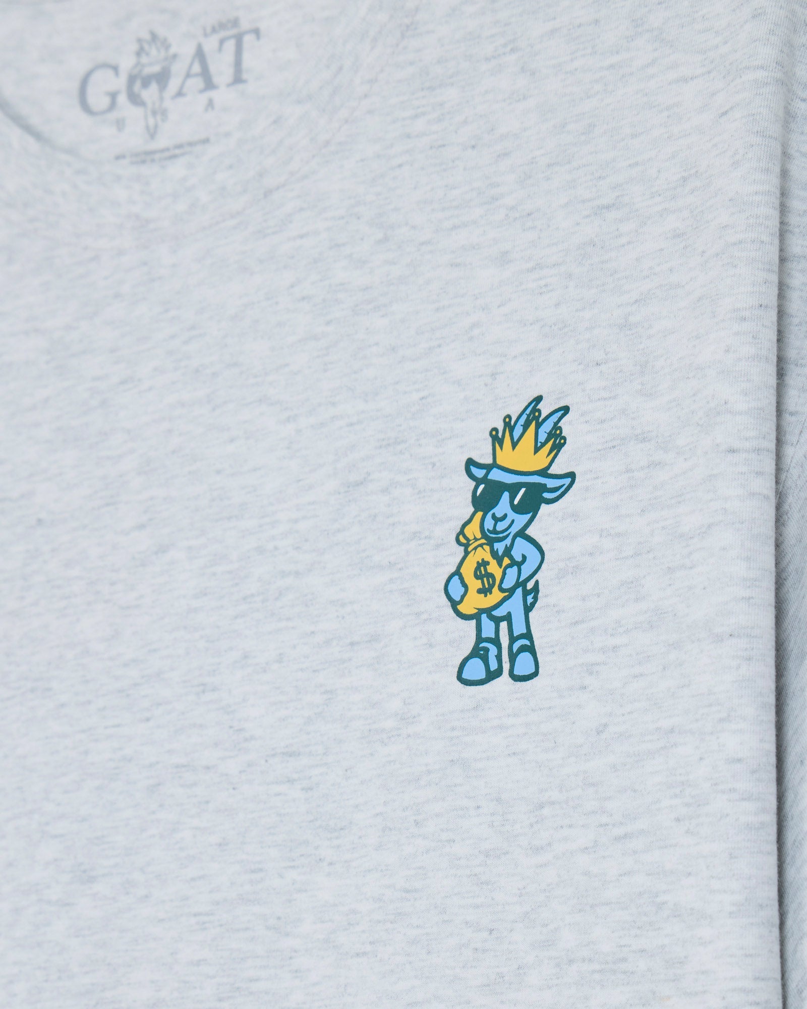 Goat holding money bag left-chest graphic on a gray t-shirt