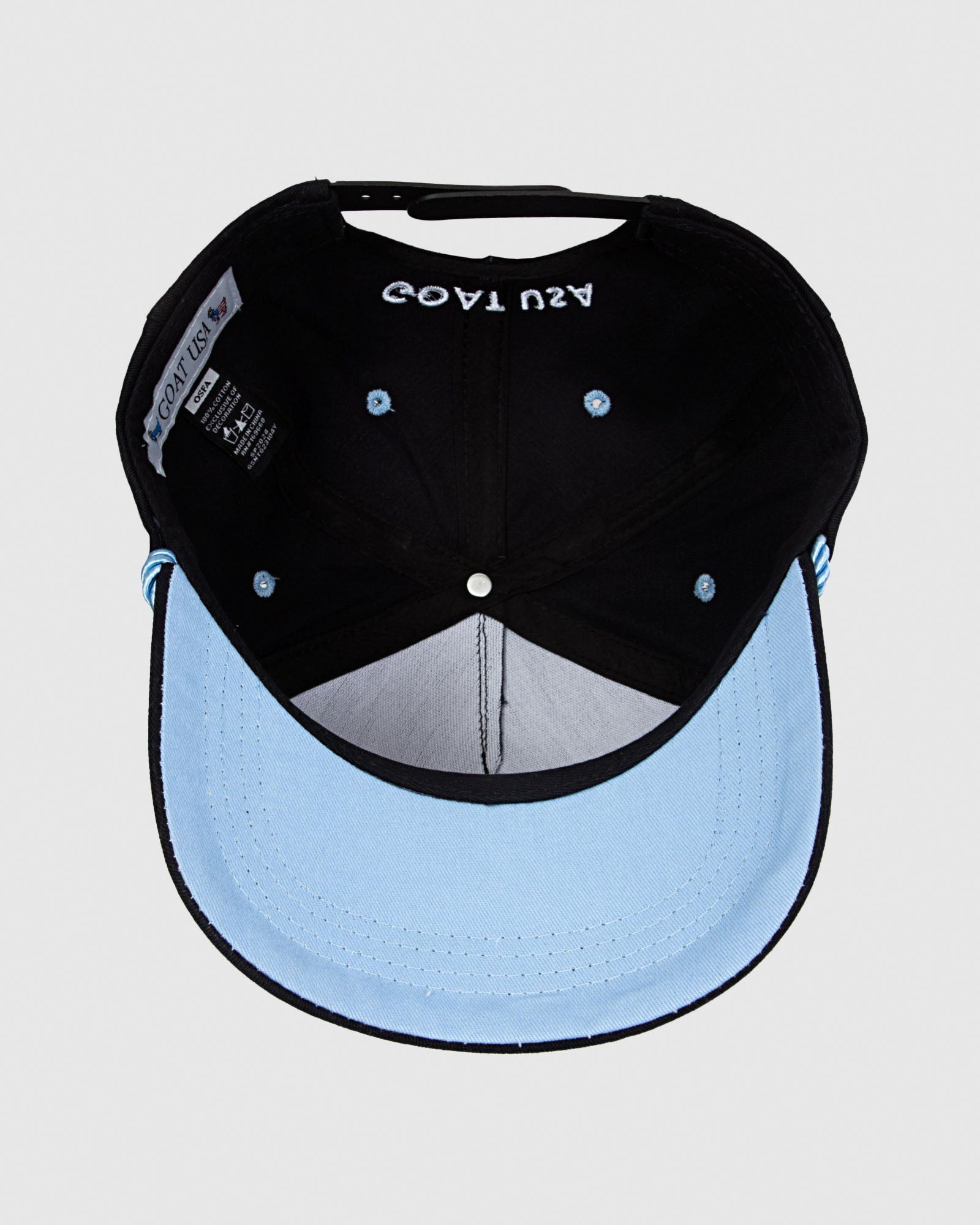 Underside of black hat showcasing carolina blue brim#color_black
