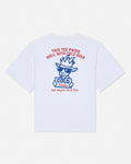 White short-sleeve t-shirt shown from the back, featuring a blue cartoon goat graphic with sunglasses and a cowboy hat, surrounded by red and blue text that reads 'THIS TEE PAIRS WELL WITH COLD BEER' and 'Only take from the ice chest'.