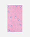 Pink towel with blue goat pattern on a white background