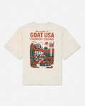 An off-white short-sleeve t-shirt with a large graphic print on the back featuring the text 'WELCOME TO GOAT USA COUNTRY CASINO' and an illustration of a red car, casino building, and desert scenery.