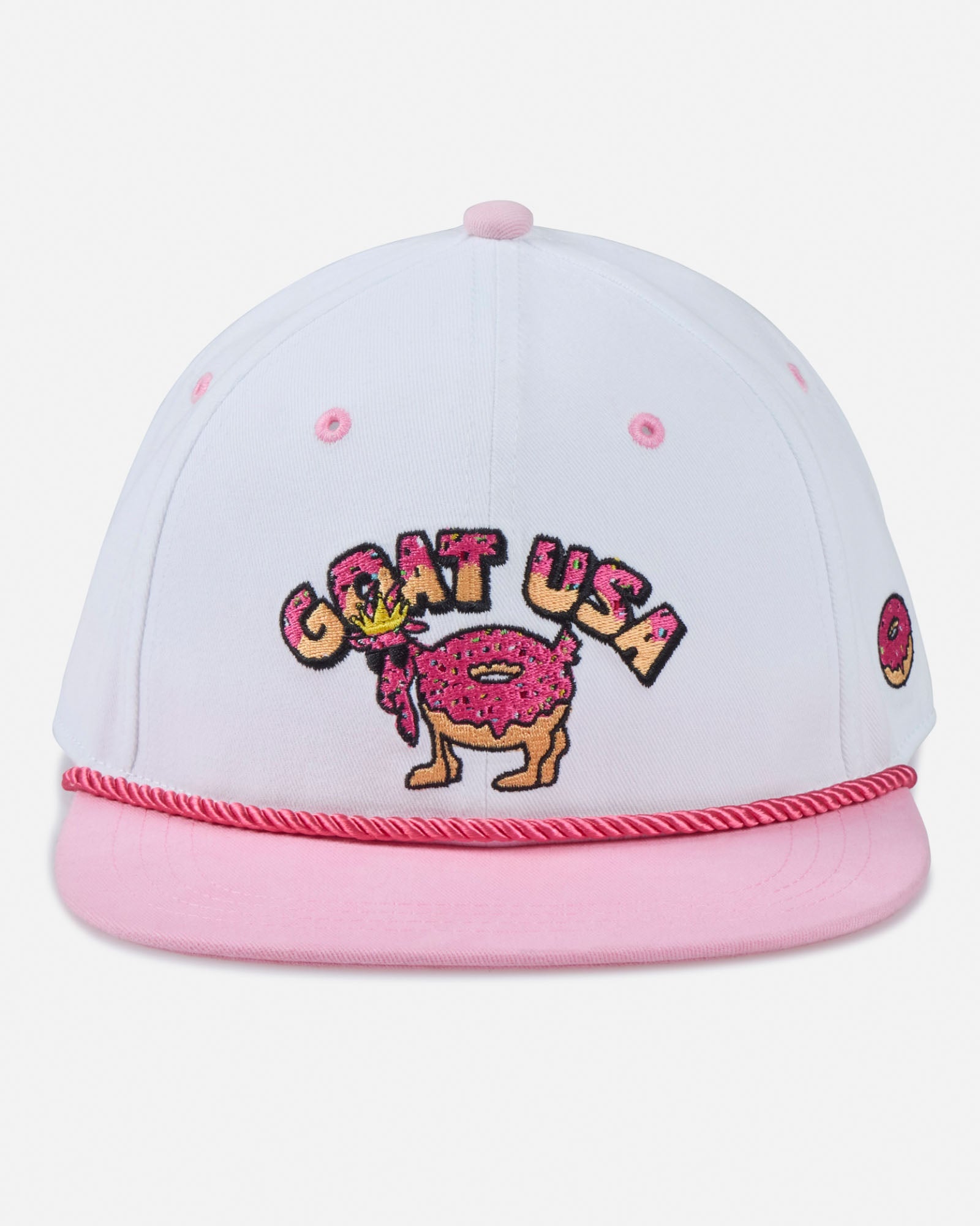 White and pink cap with 'GOAT USA' design on a light gray background