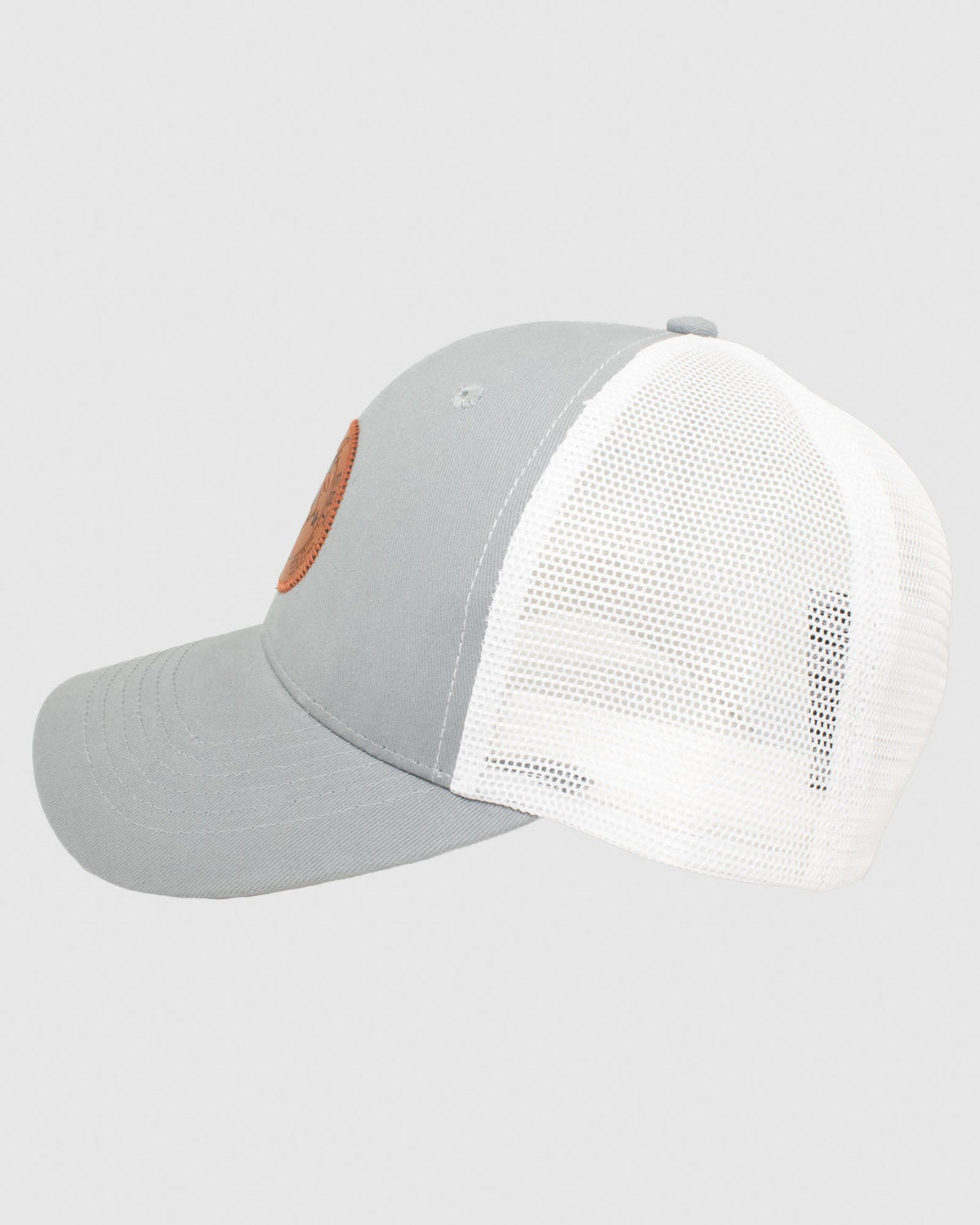 Side view of gray hat with white mesh and brown leather patch