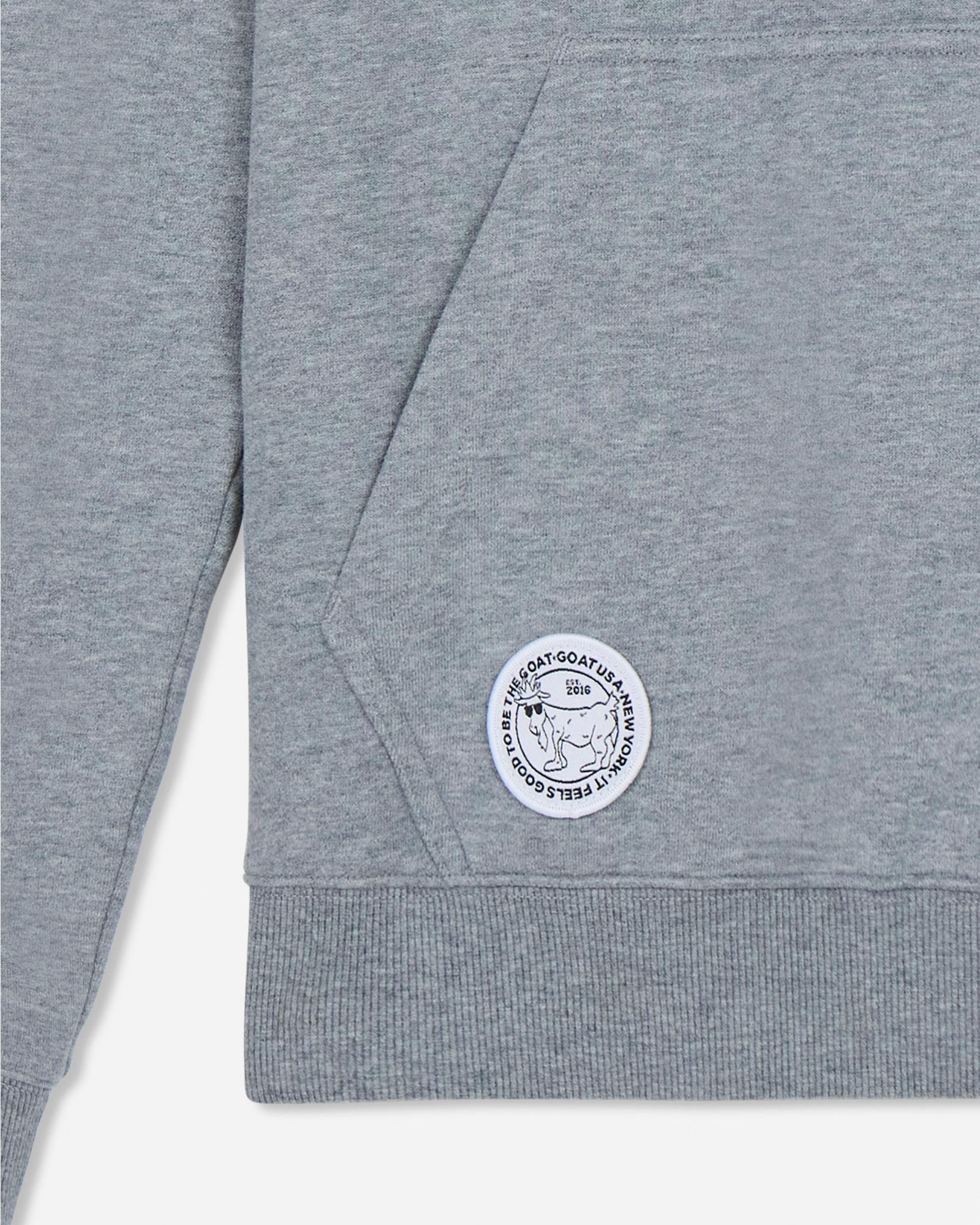 Gray hoodie with a circular logo on a light gray background#color_gray