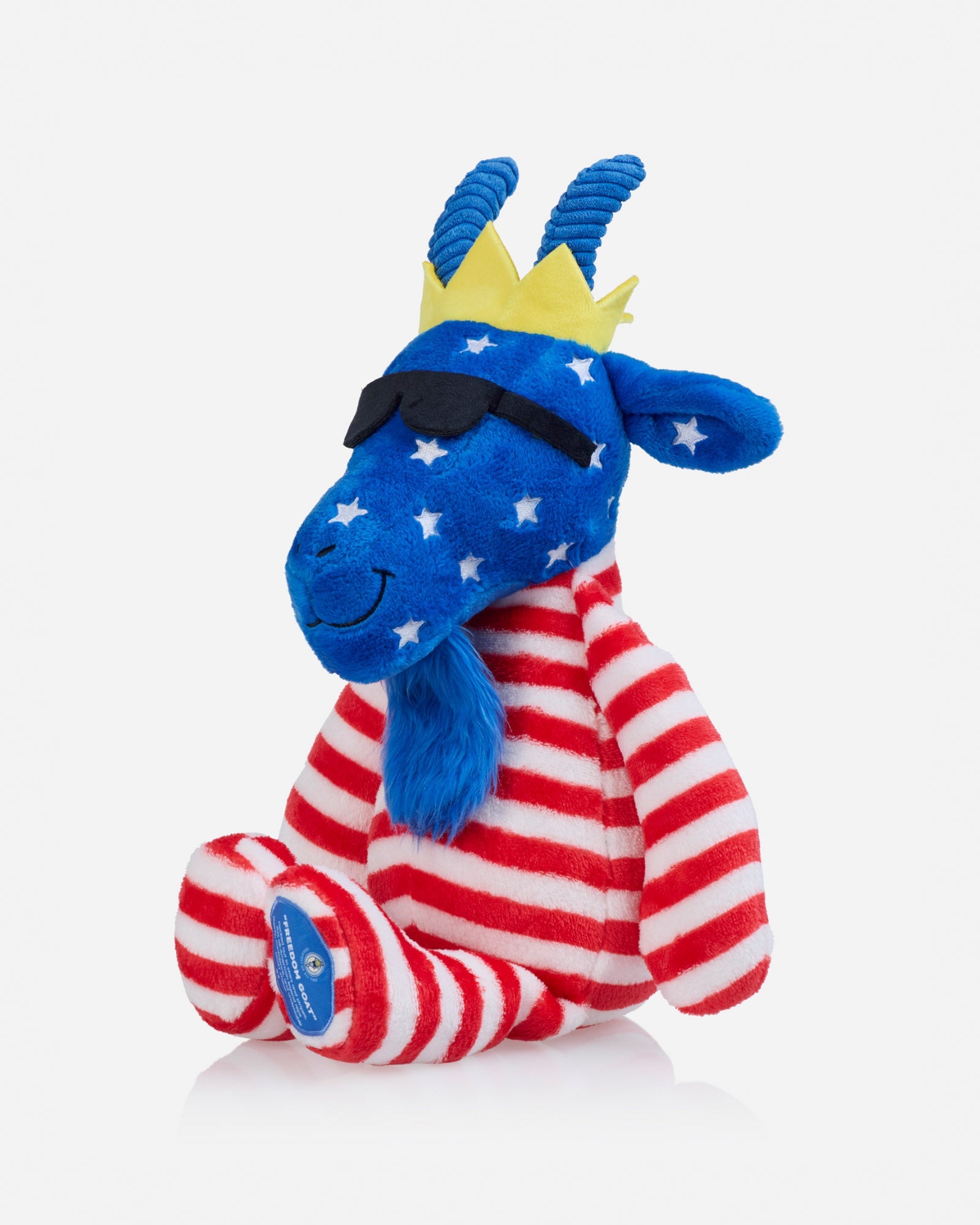 Plush toy with blue face, red and white striped body, and yellow crown on a white background