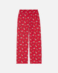 Red lounge pants with an all-over repeating print of small white goats with pink and red details, shown flat against a light gray background.