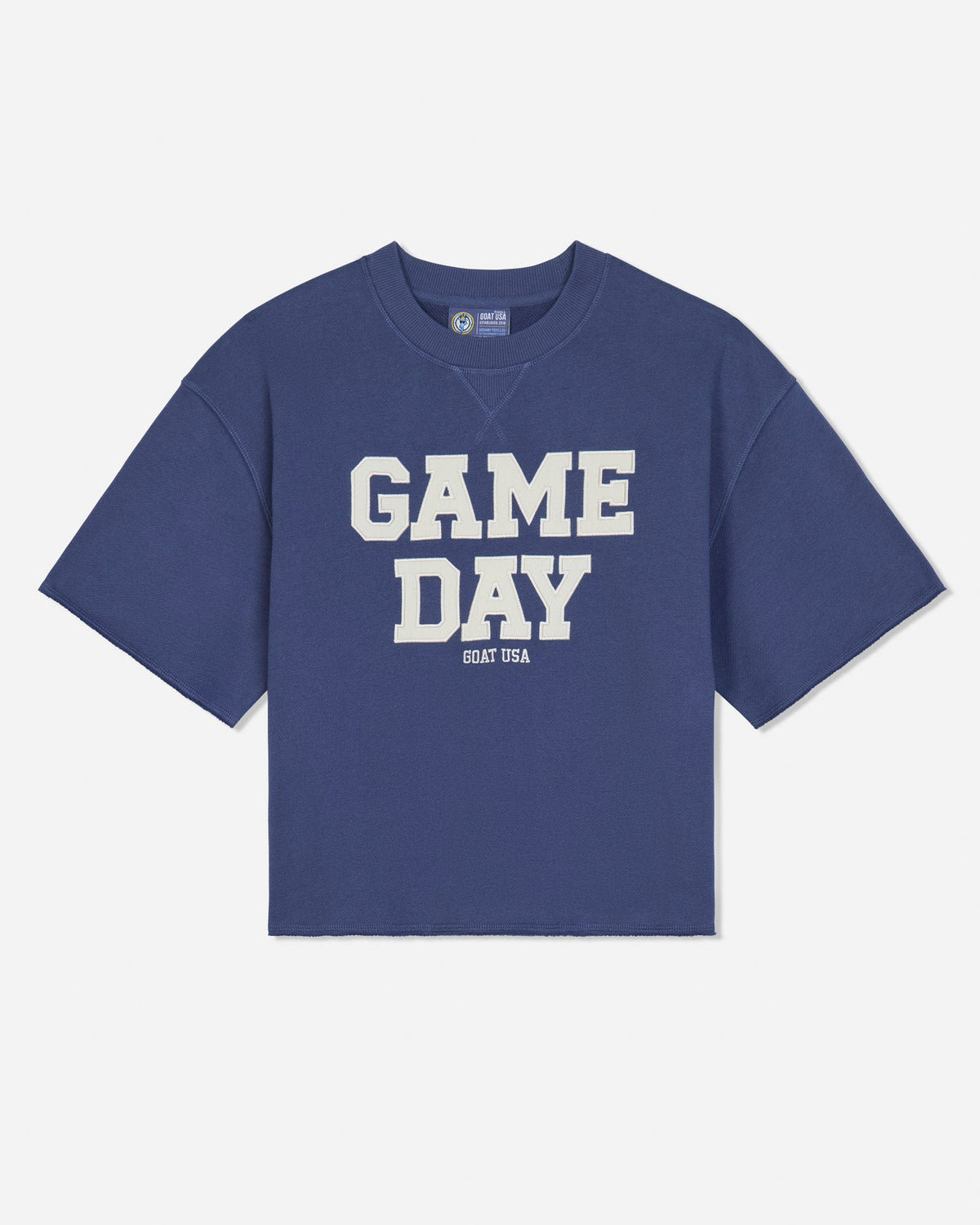 A blue short-sleeve french terry t-shirt with 'GAME DAY' printed in bold white block letters on the front, with 'GOAT USA' printed underneath, shown against a light gray background.#color_navy