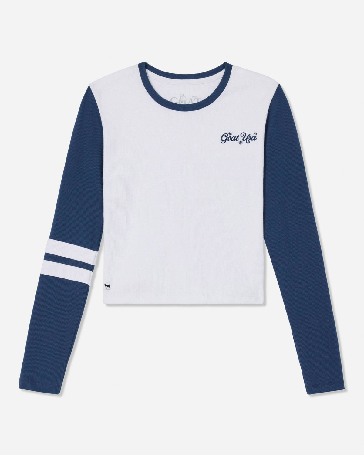 A long-sleeve crop top with a white body and navy blue sleeves, featuring a navy blue crew neck, white stripes on one sleeve, and 'Goat Usa' embroidered on the left chest.