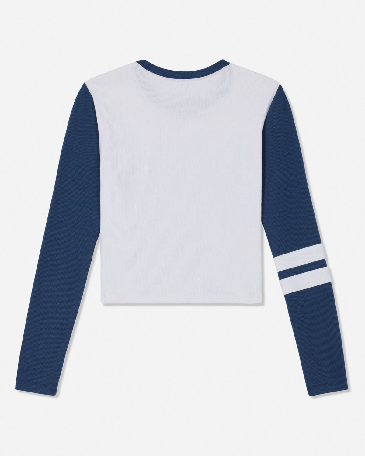 A long-sleeve crop top with a white body and navy blue sleeves, featuring two white stripes on the right sleeve, shown against a plain white background.