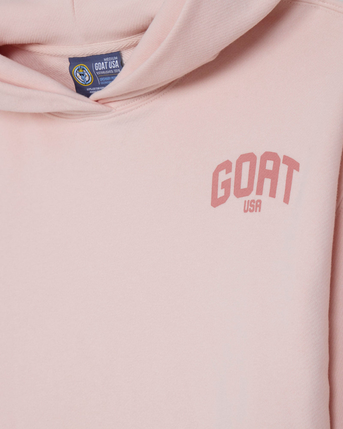Close-up of front of pink cropped hooded sweatshirt