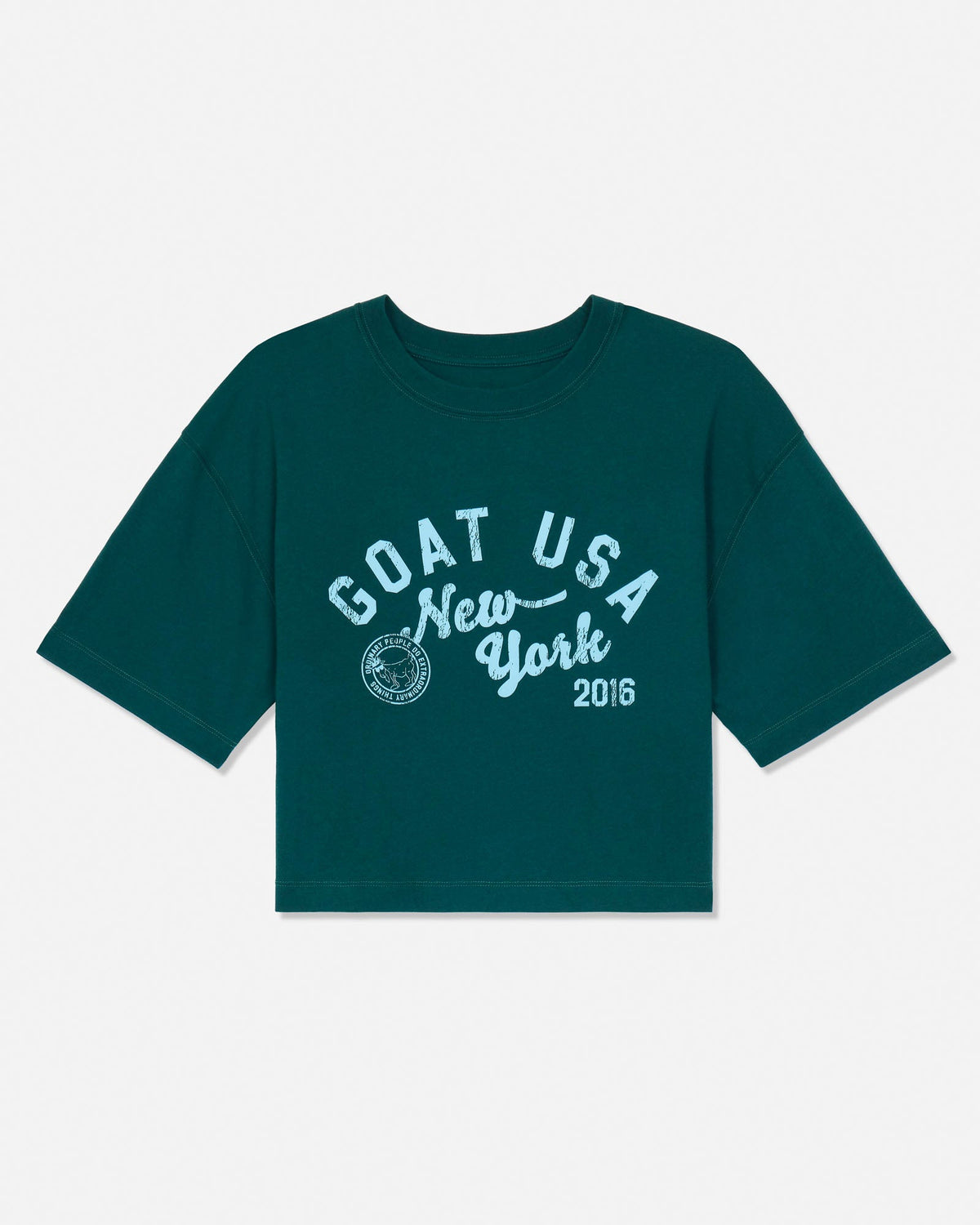 A dark teal green short-sleeve t-shirt with a white graphic print on the front reading 'GOAT USA New York 2016' and a circular crest, displayed flat against a light gray background.