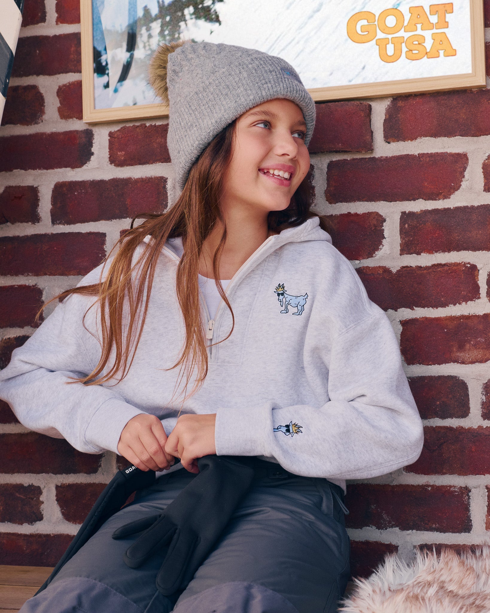 Person in a gray half zip hoodie#color_pale-gray