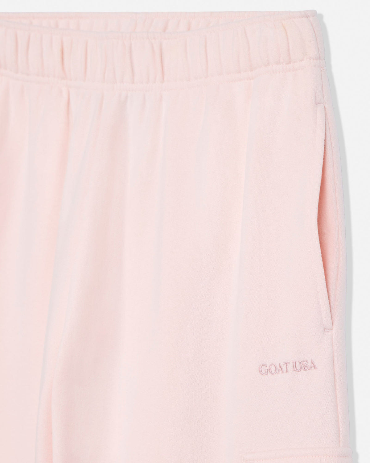 Close-up of pocket on pink women's cargo sweatpants