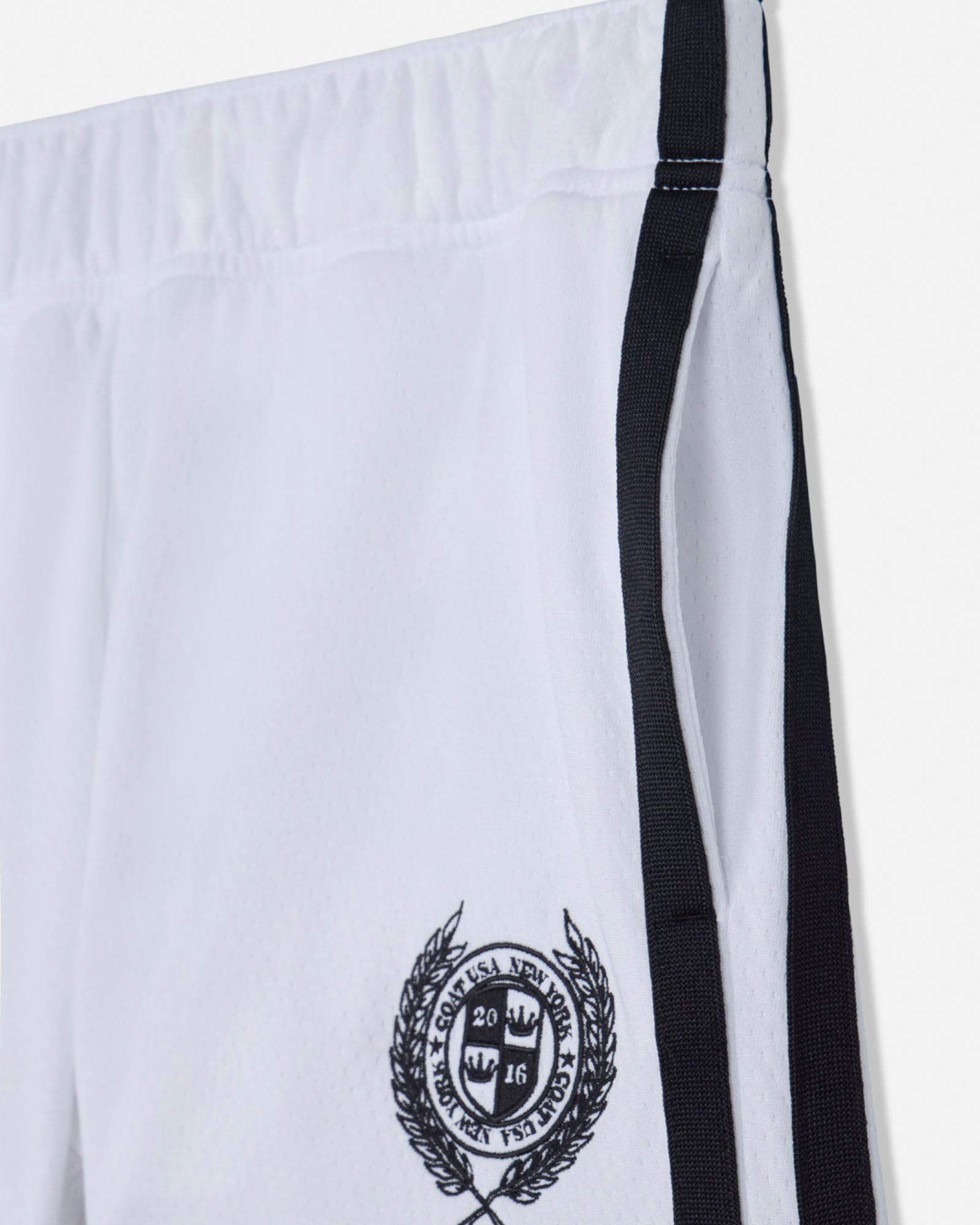 White shorts with black emblem and straps on a white background#color_white