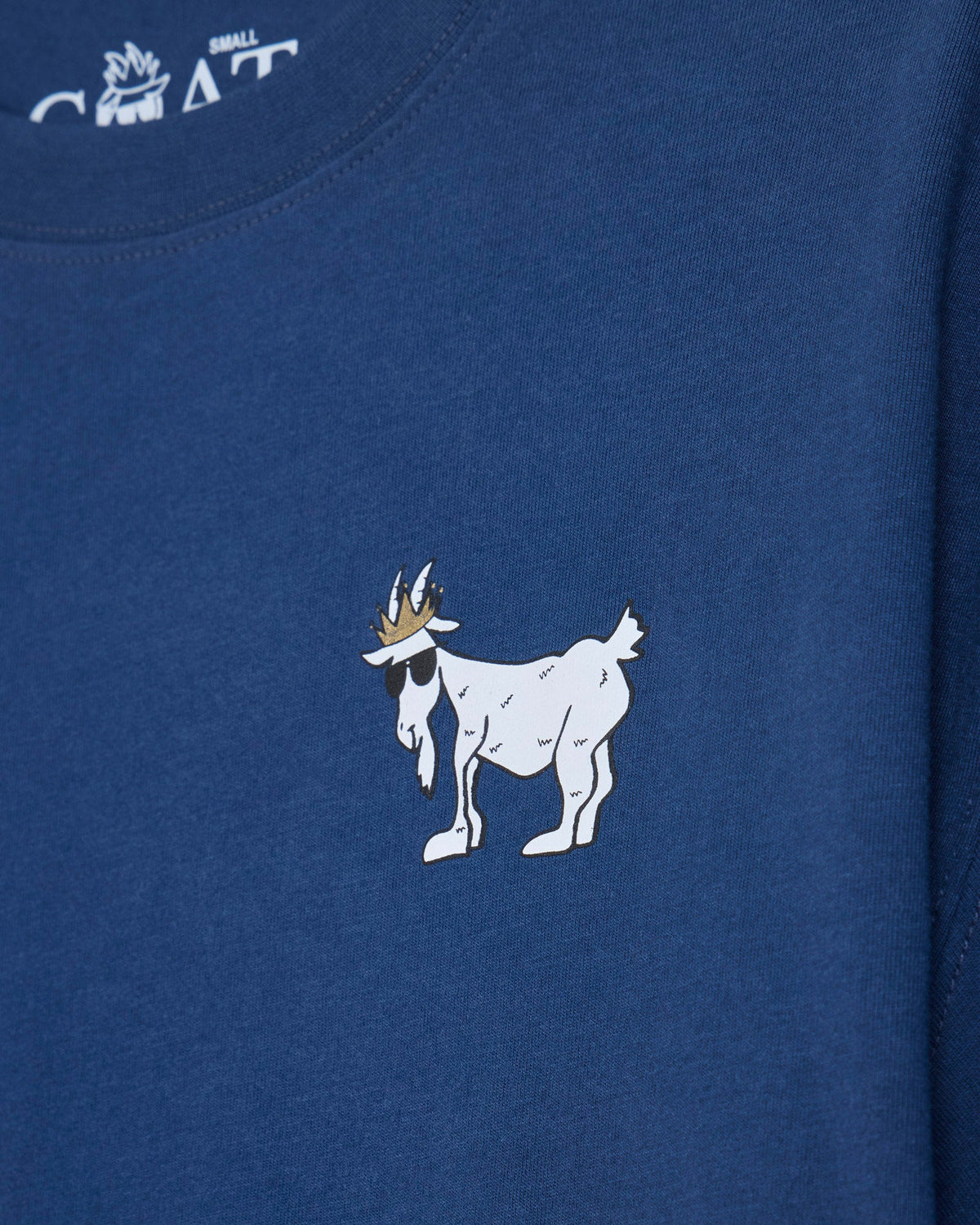 Close-up of blue oversized crop top with white goat design
