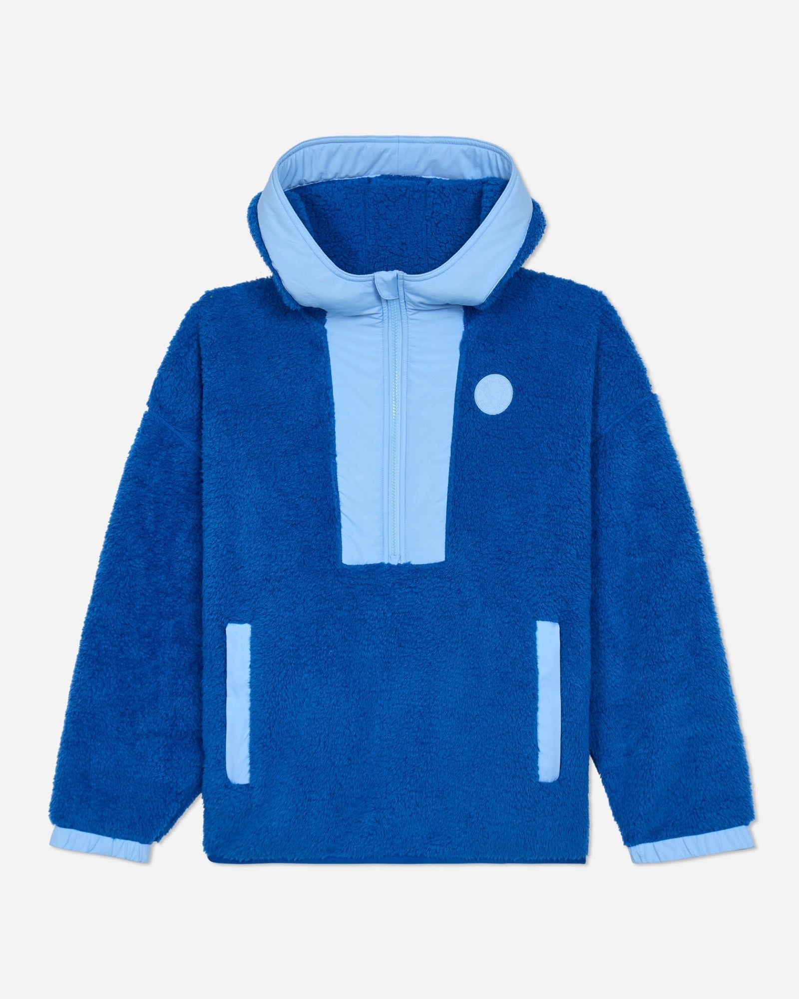 Blue sherpa jacket with light blue accents on a light gray background