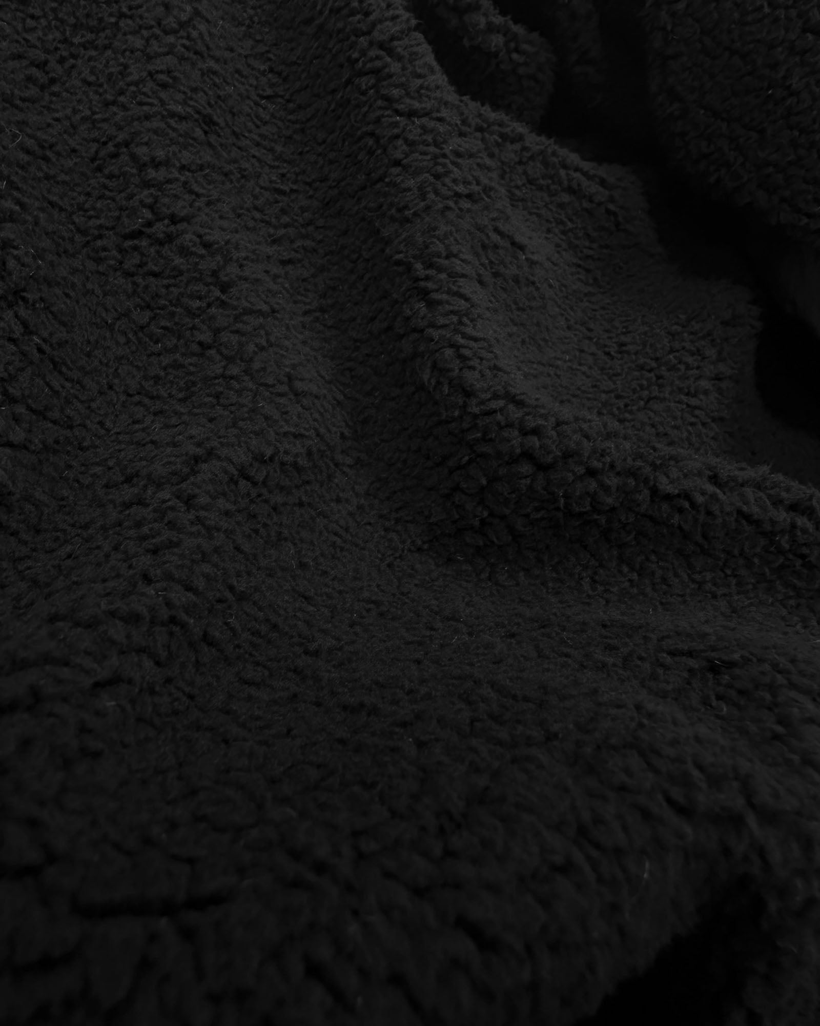 Close up of fleece on black Women's Puffer Fleece Vest#color_black