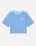 Light blue t-shirt with white stripes on sleeves and collar against a light gray background#color_carolina-blue