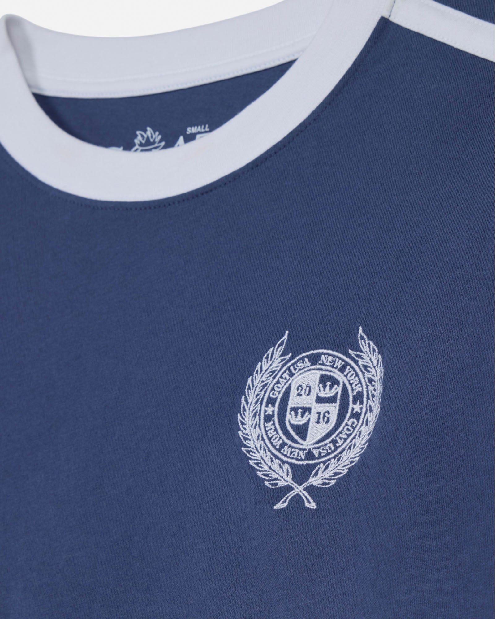 Navy blue t-shirt with a white emblem and text on a white background#color_navy