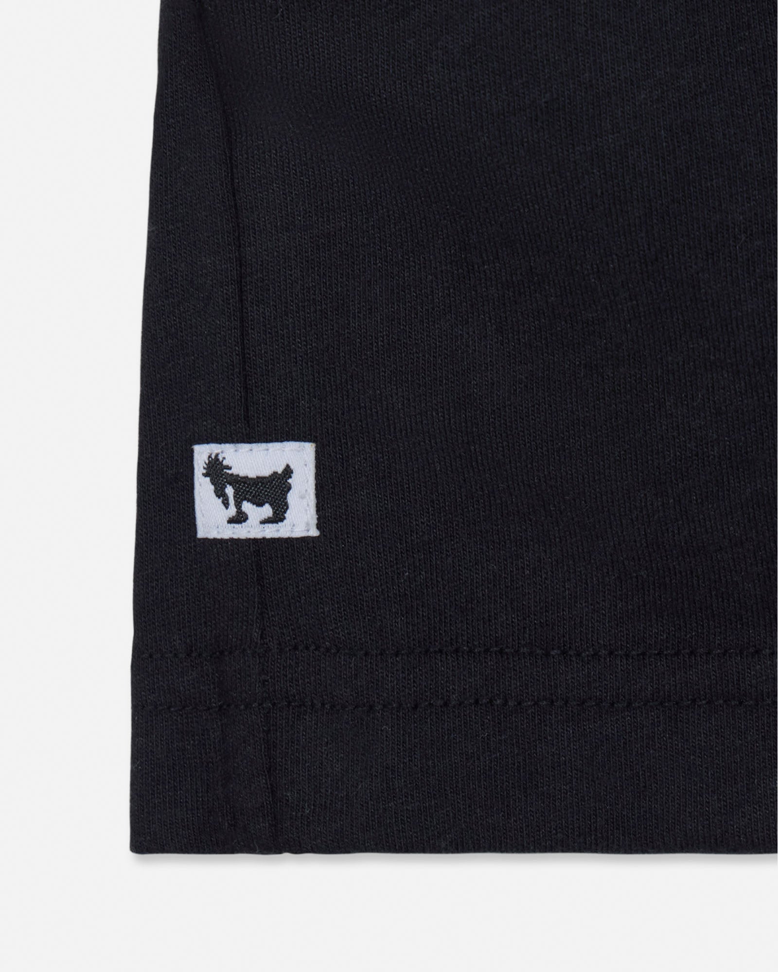 Black fabric with a small white logo featuring a black silhouette on a white background#color_black