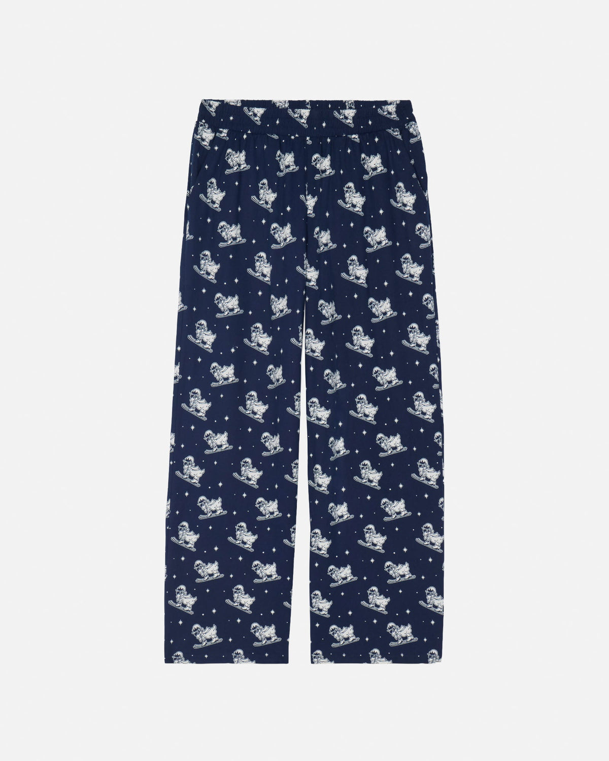 A pair of navy blue pants with an all-over white print of cartoon goat skiiers and stars, shown flat against a light gray background.