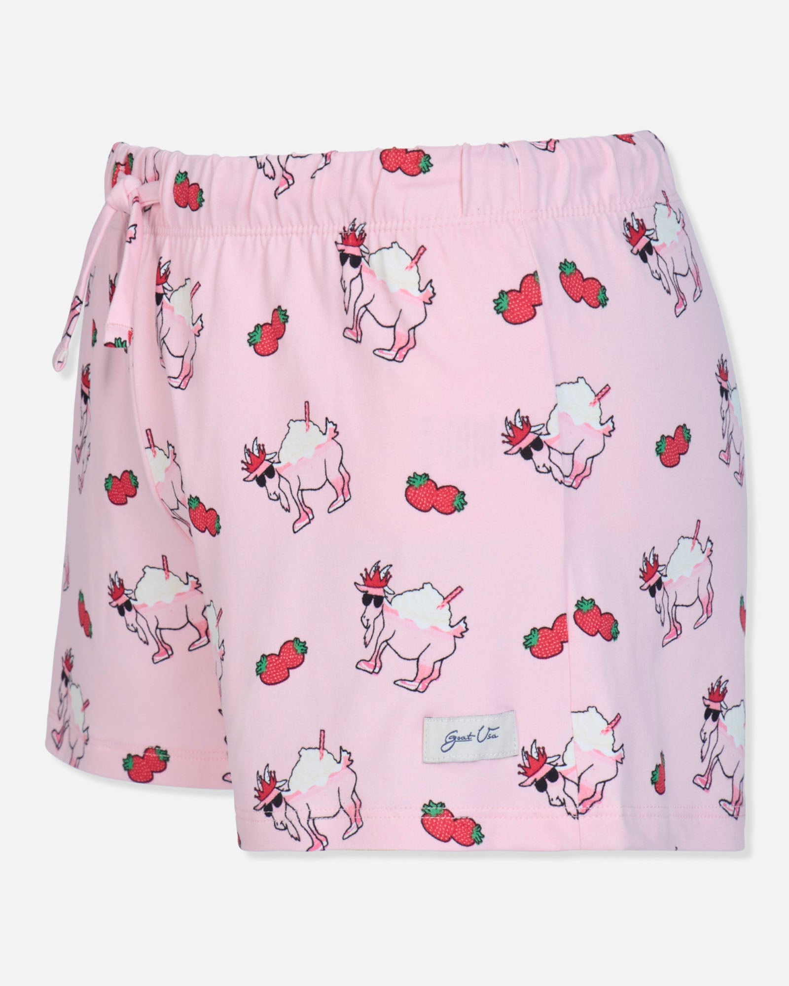 Pink shorts with goat and strawberry pattern on a white background