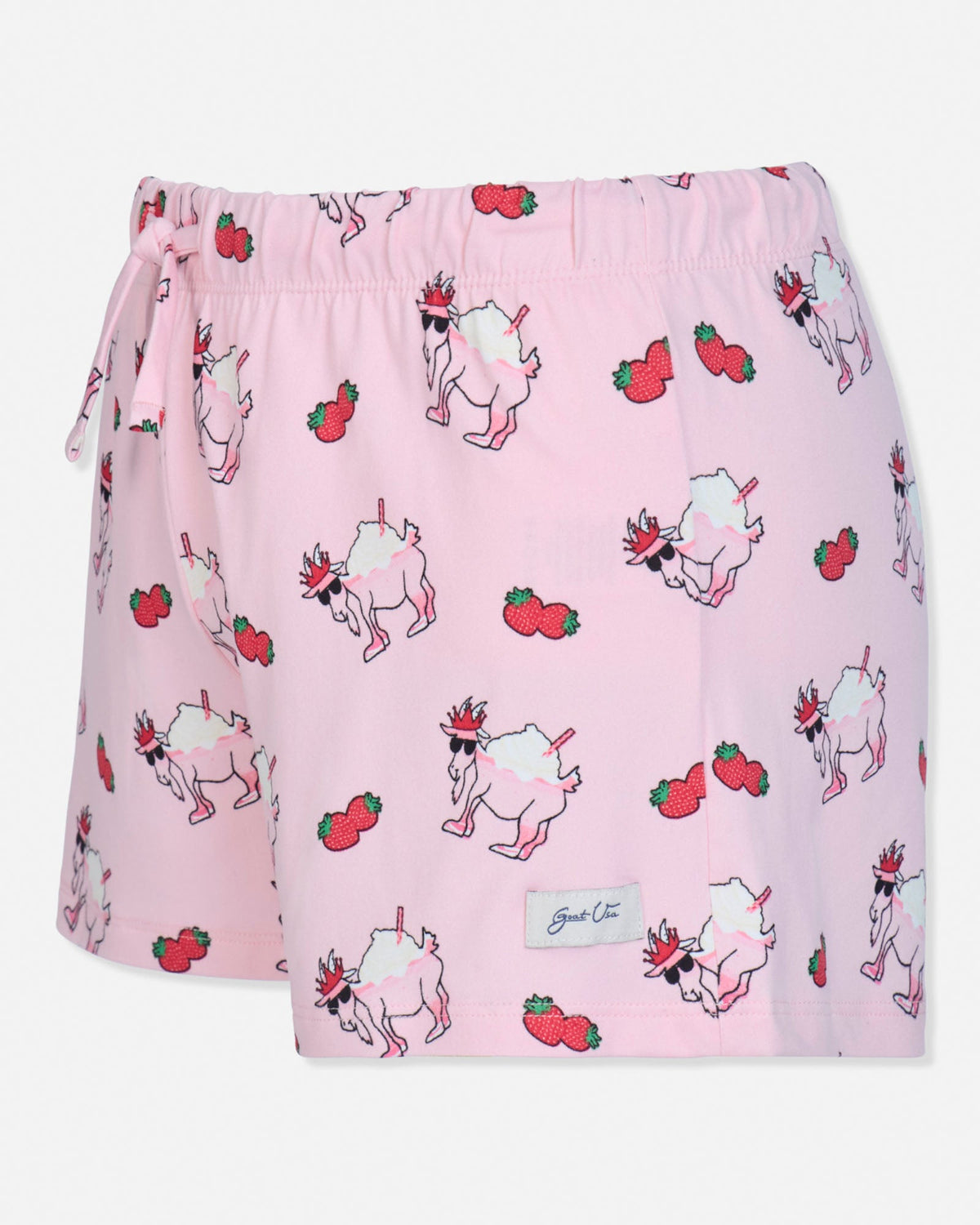 Pink shorts with goat and strawberry pattern on a white background