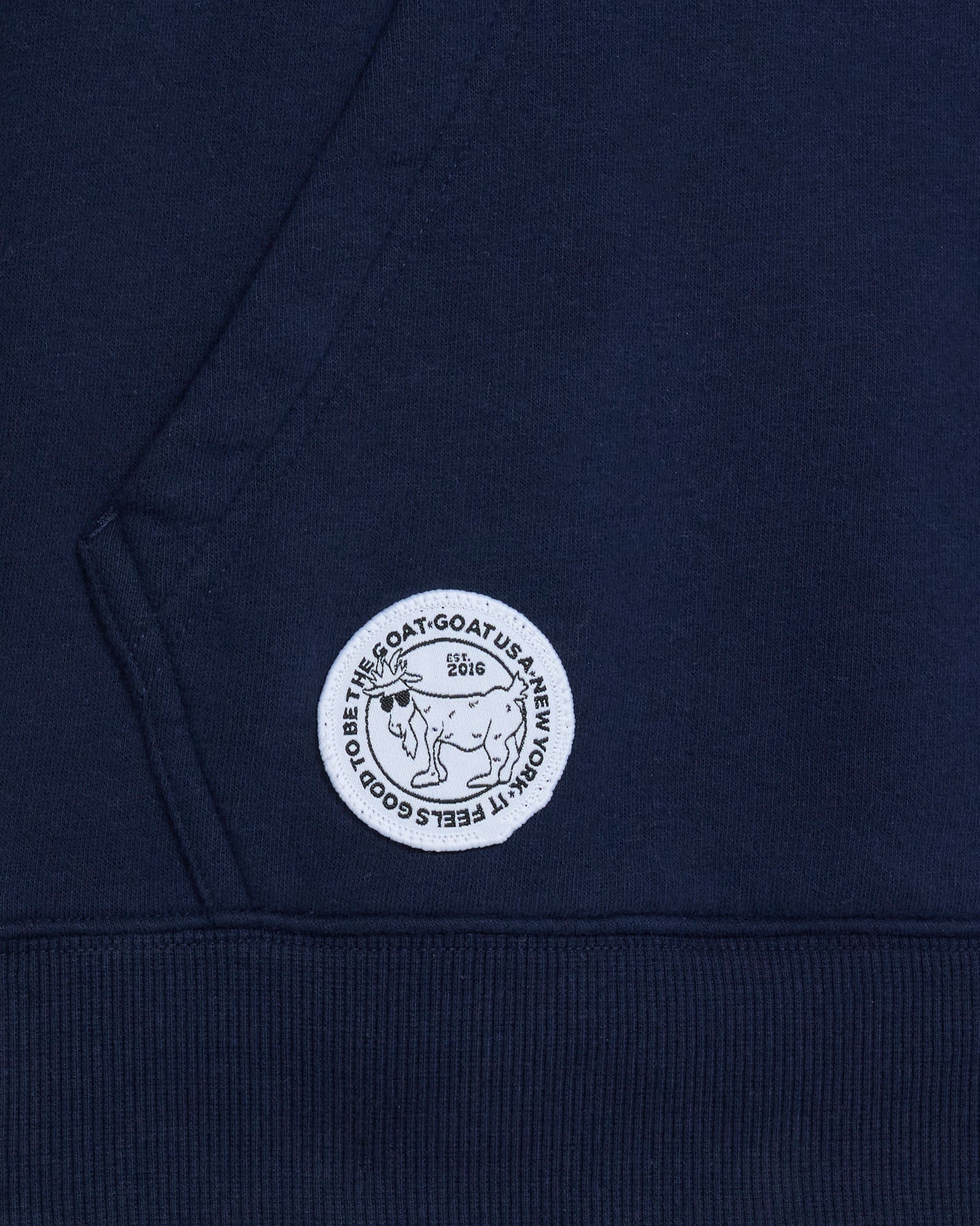 Navy blue hoodie with a white logo on the chest